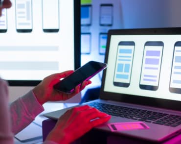 IT specialist working on a mobile device
